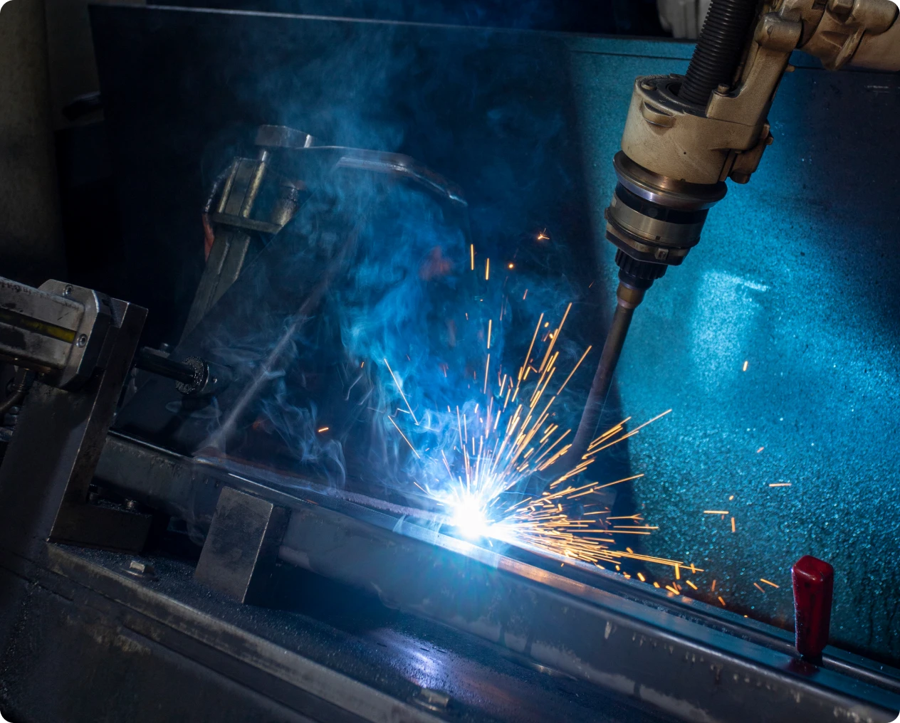 Industrial robot welding metal pieces