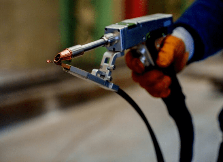 Person operating industrial welding tool.