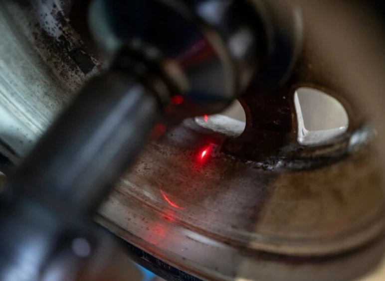 Industrial laser inspecting metal surface