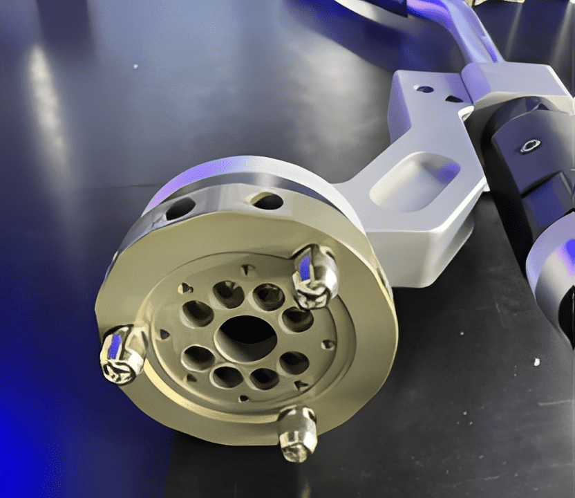 Mechanical component with bolts on metallic surface.