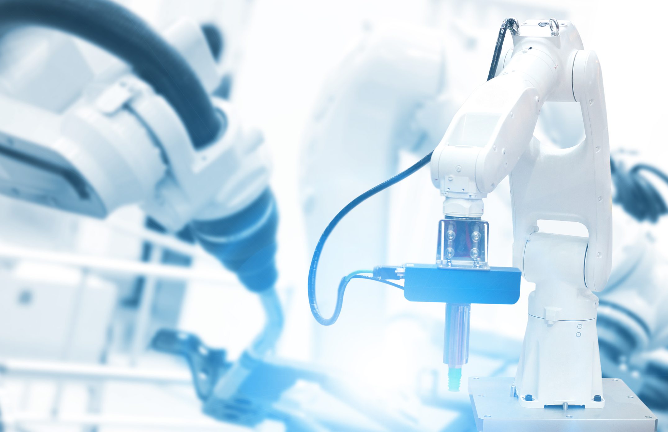 Robotic arm in industrial automation setting.