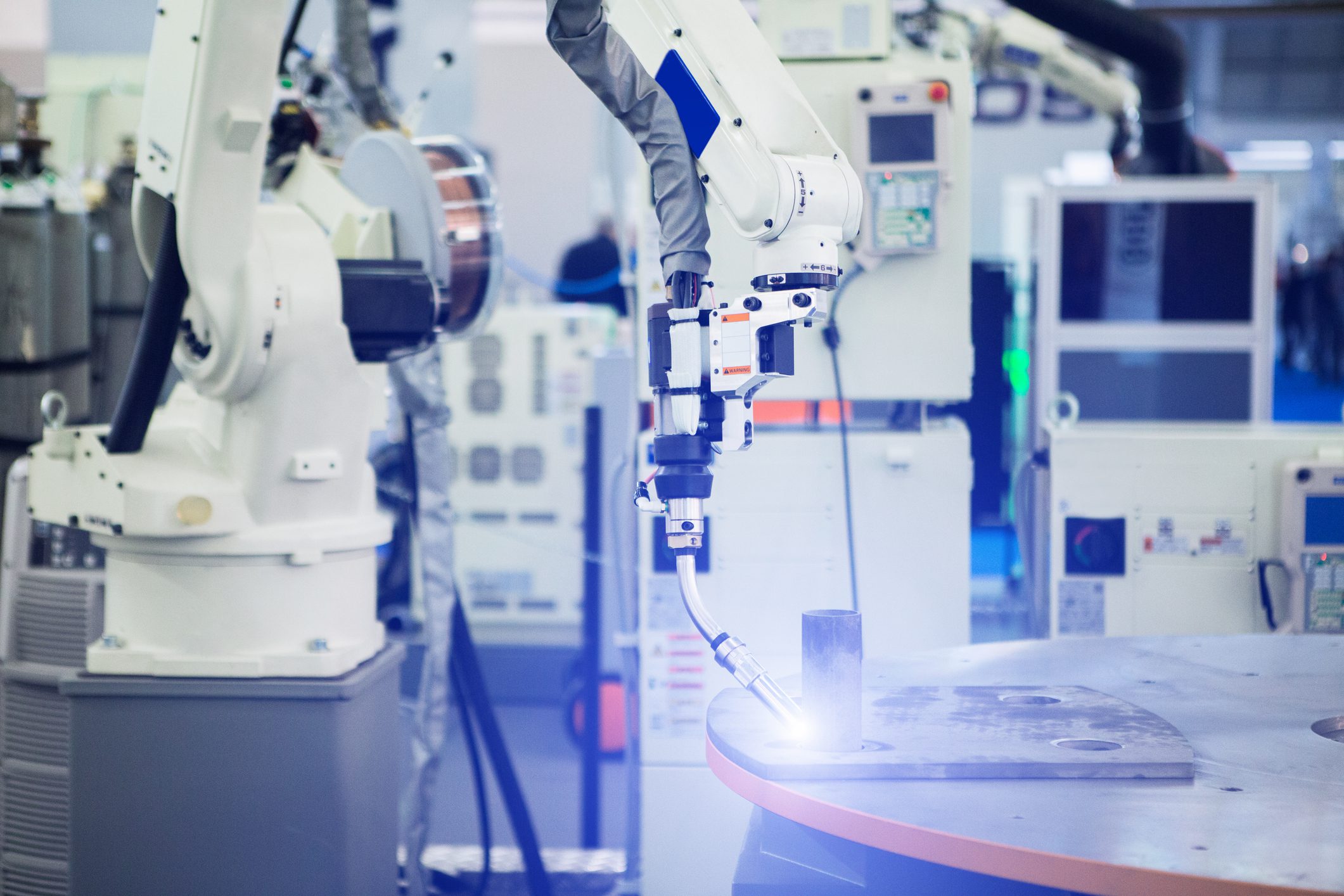 Robotic arm performing industrial welding task.