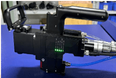 Industrial tool with control handle and cables.