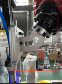 Robotic arm in industrial setting.