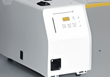 White portable machine with black handle.